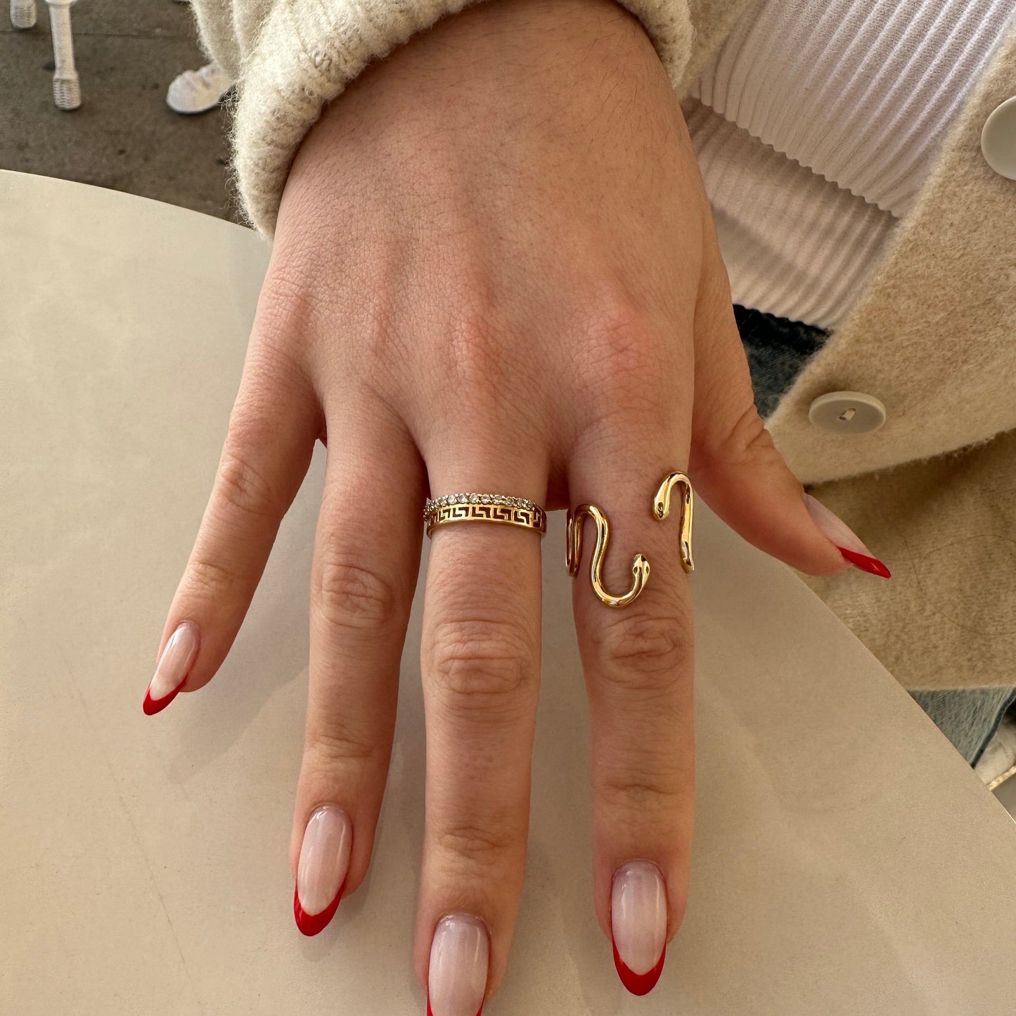 This photo shows our model wearing the snake ring on her index finger with her hand open.